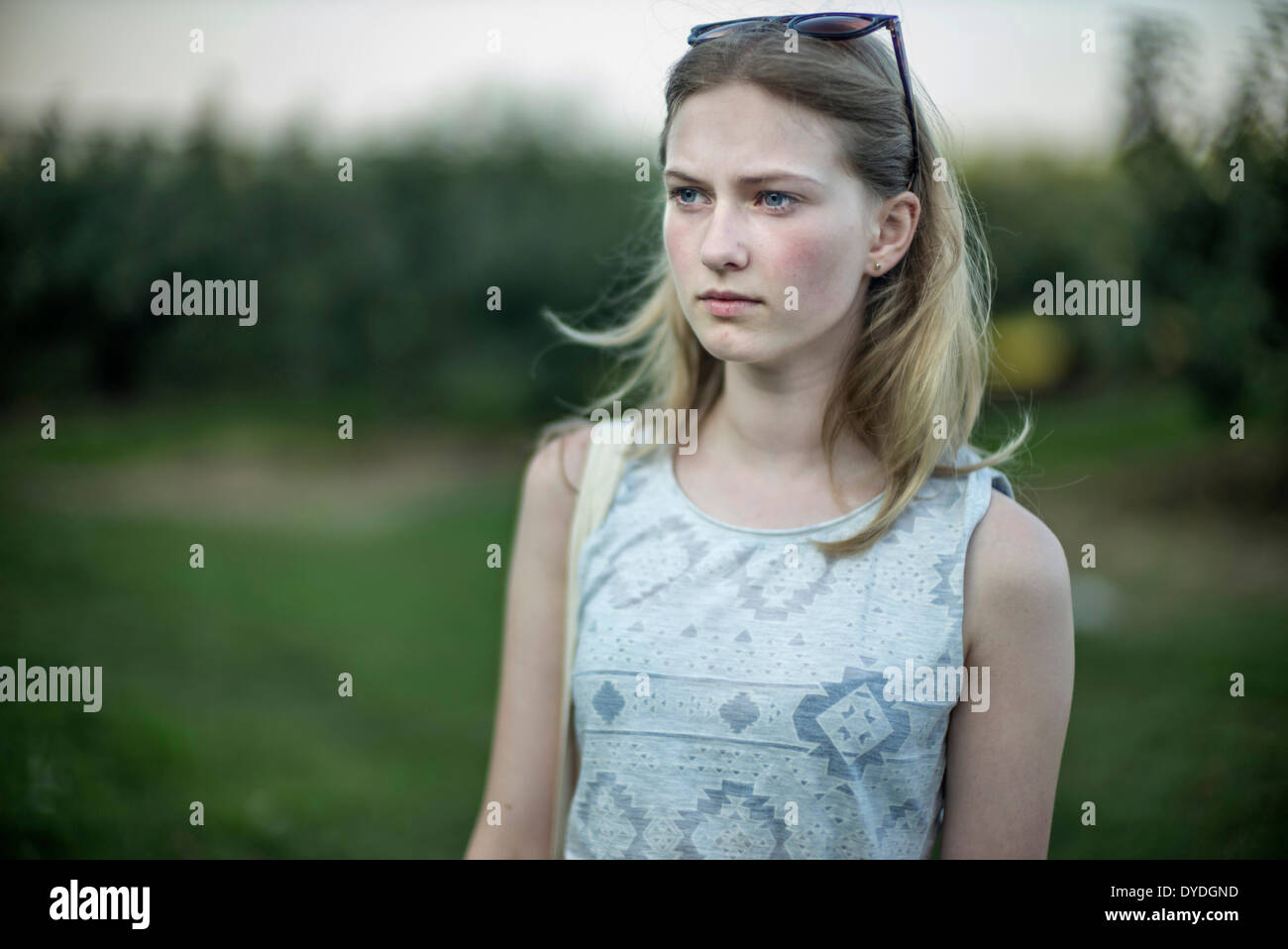 Daydreaming girl in the countryside. Stock Photo