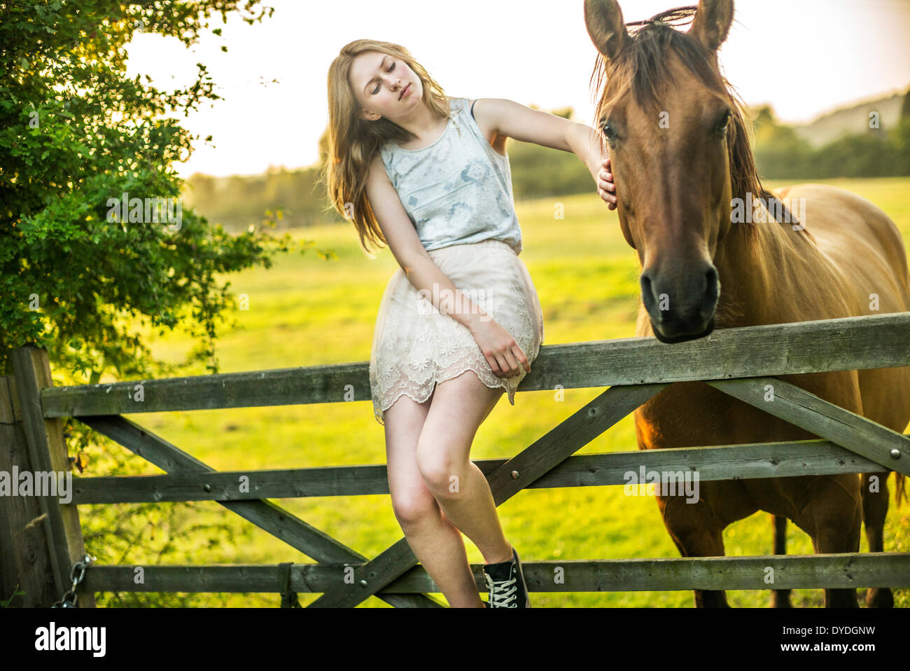 A 15 year old girl with a horse. Stock Photo