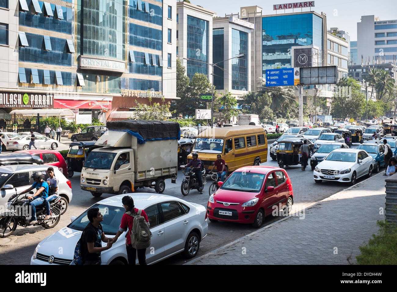Busy midday traffic in on a suburban road in Mumbai. Stock Photo