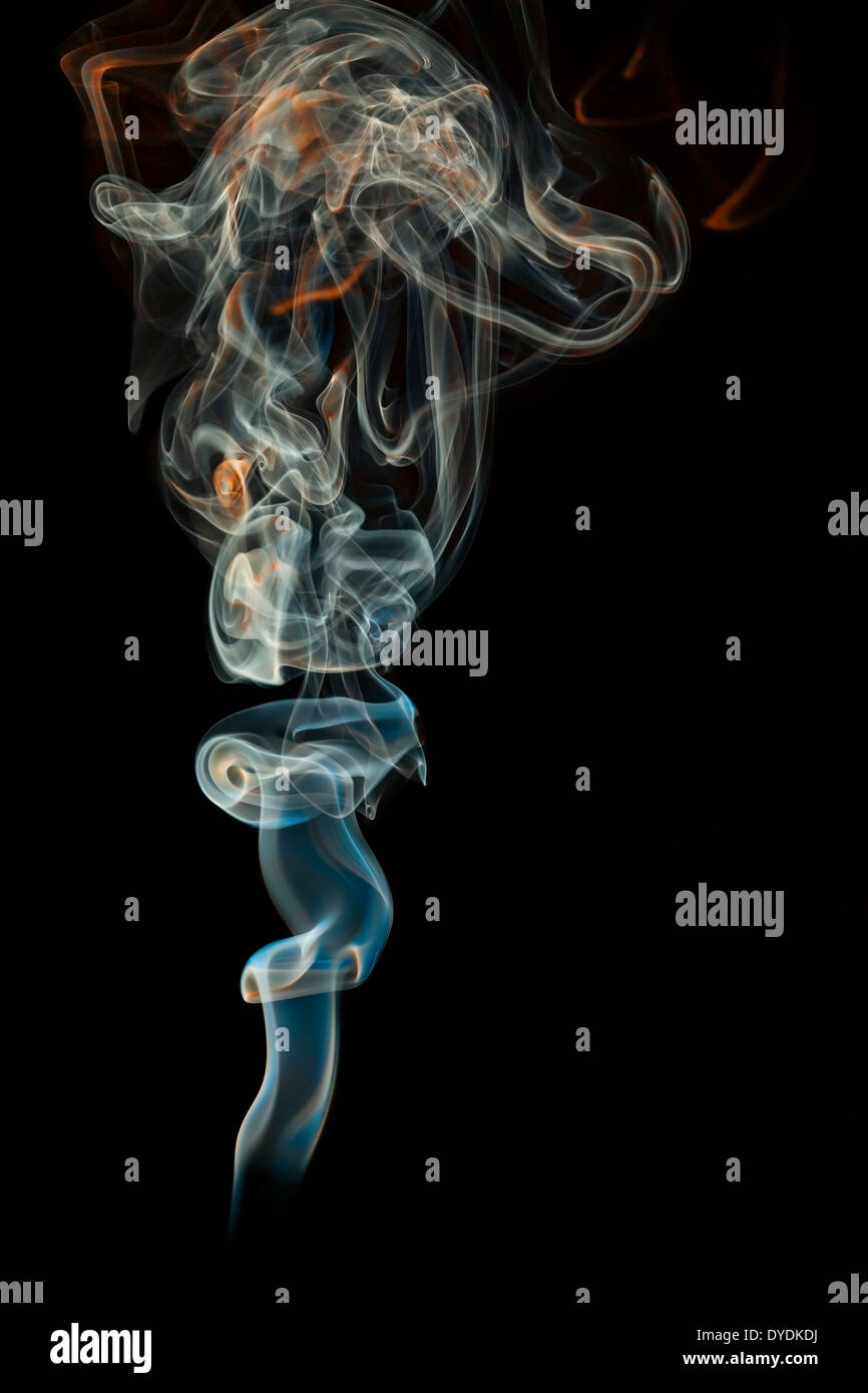 colored smoke isolated on a black background Stock Photo - Alamy