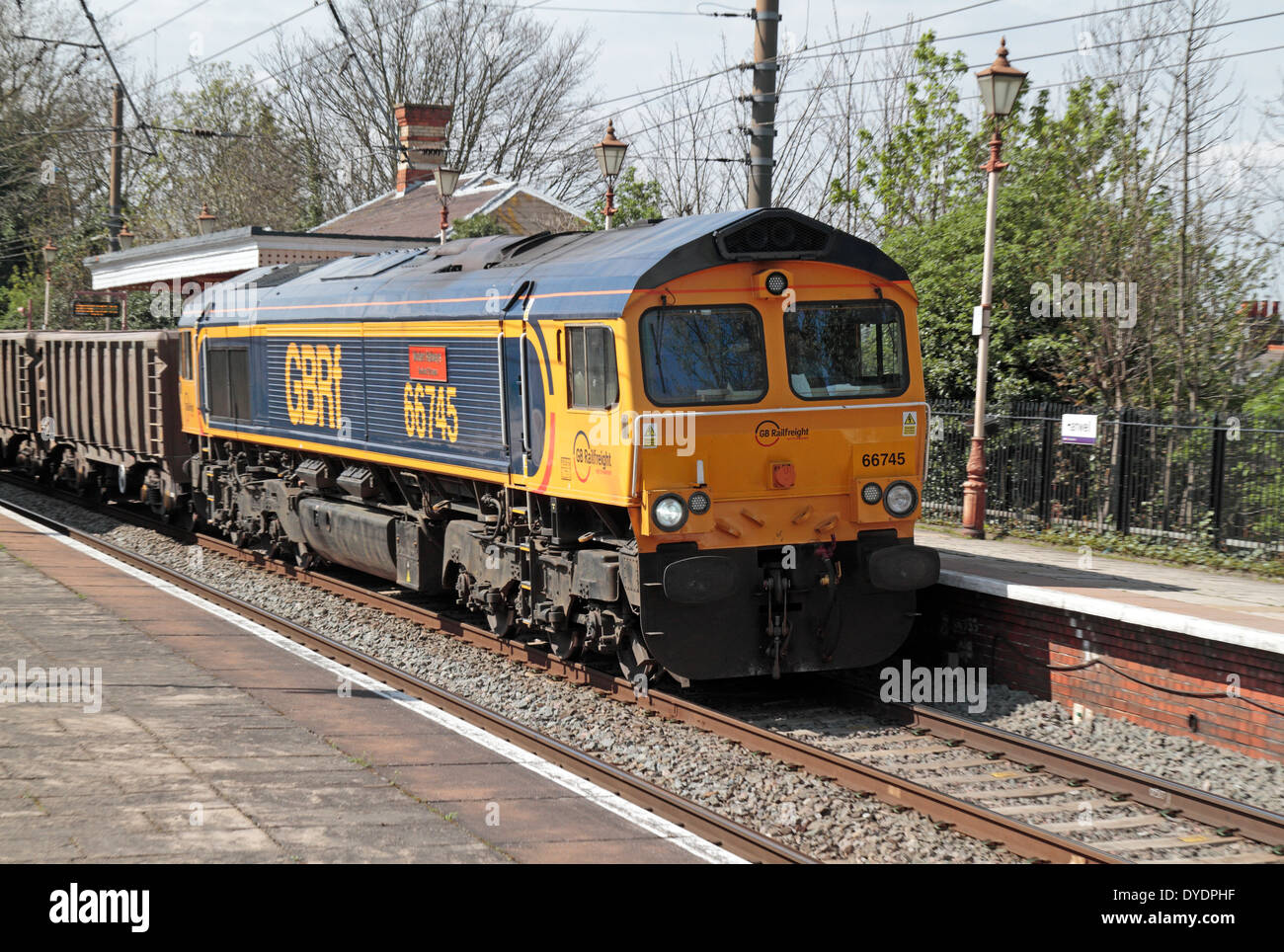 GB Railfreight goods train passing through Hanwell & Elthorne station, London, UK Stock Photo