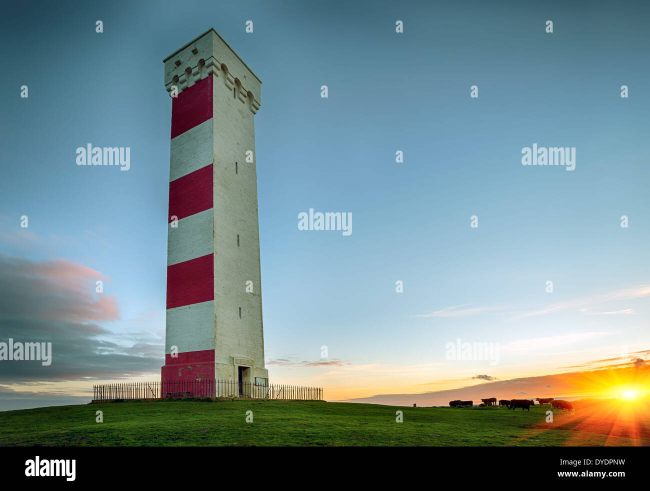 Sunset at the Gribbin Head lighthouse in Cornwall Stock Photo