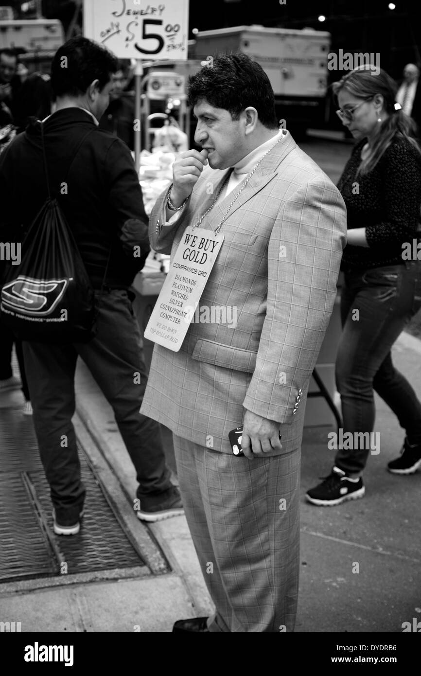 A man advertises to buy gold on a Fifth Avenue corner, New York City. Stock Photo
