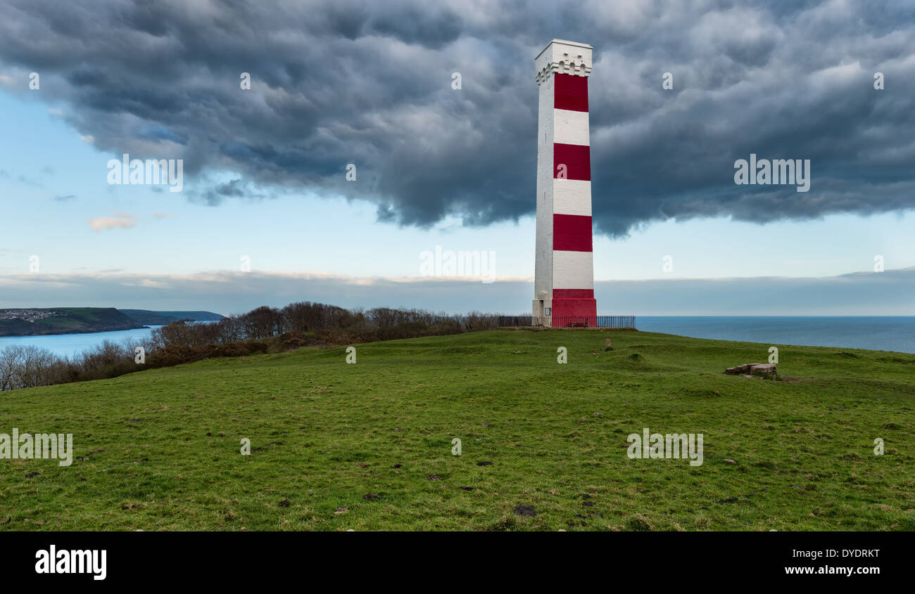 Storm clouds gather over the daymark lighthouse on Gribbin Head near St Austell in Cornwall Stock Photo
