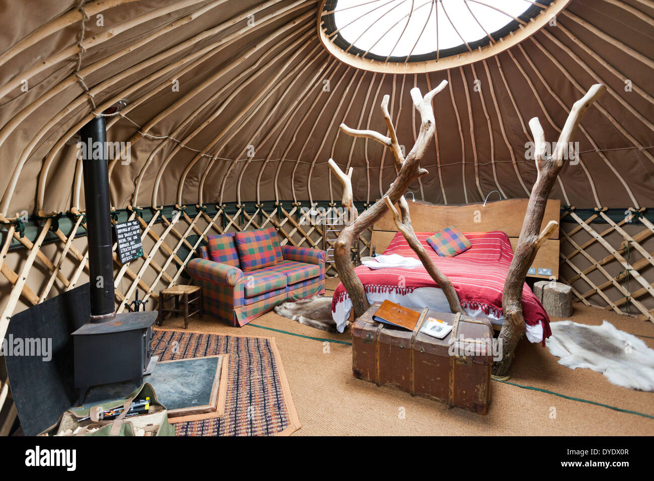 The interior of the yurt 'Coracle' at the luxury glamping site Crafty Camping at Holditch, Dorset UK Stock Photo