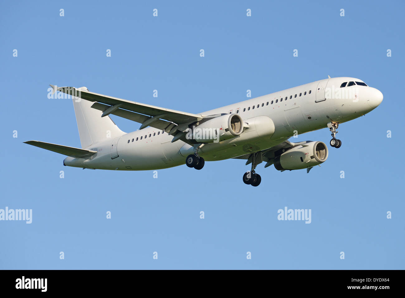 Generic white Airbus A320 approaching London Gatwick Stock Photo