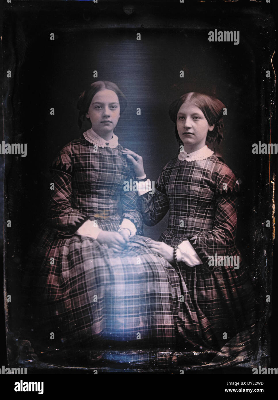 Two Teen Girls in Identical Plaid Dresses, Portrait, Daguerreotype, Circa 1850's Stock Photo