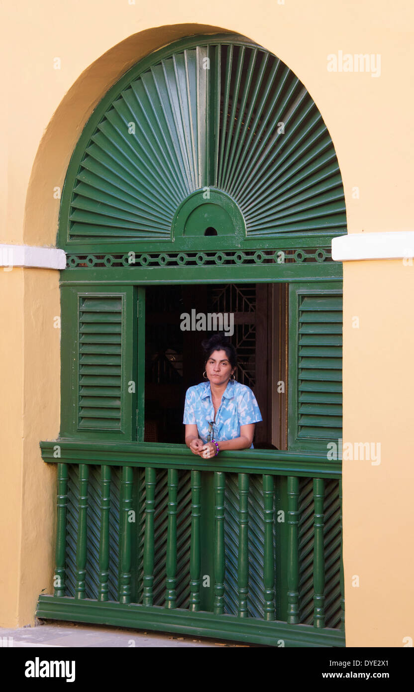 Woman in window Palacio Brunet Trinidad Sancti Spiritus Province Cuba Stock Photo