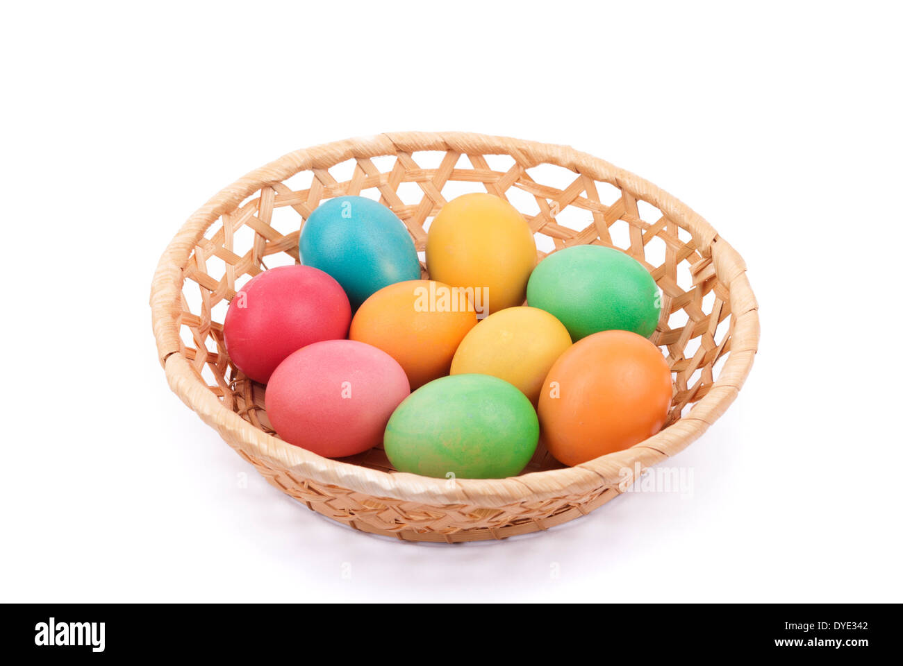 Easter painted eggs in a basket, isolated on white Stock Photo - Alamy