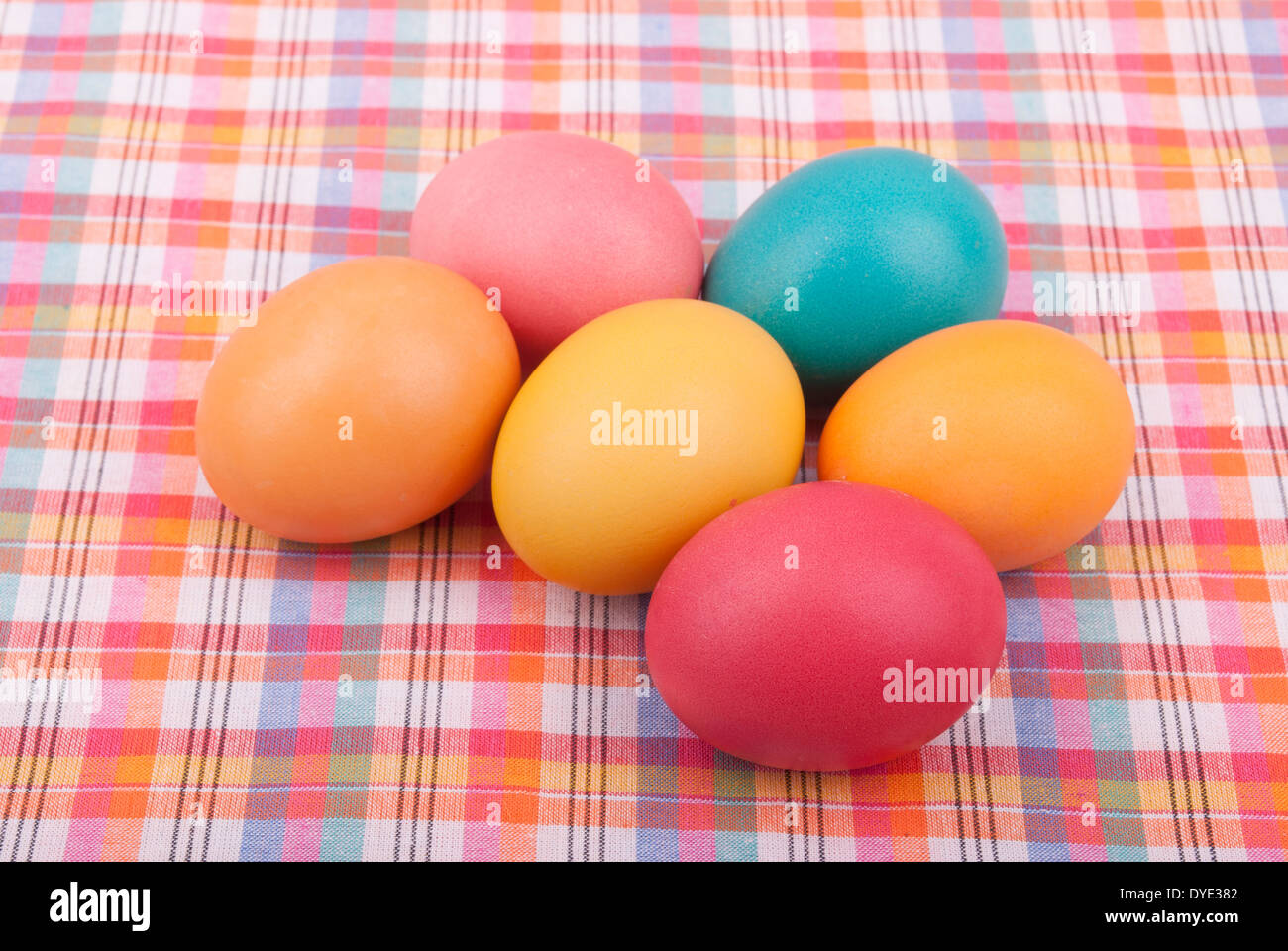 Easter colored eggs on the tablecloth. Stock Photo
