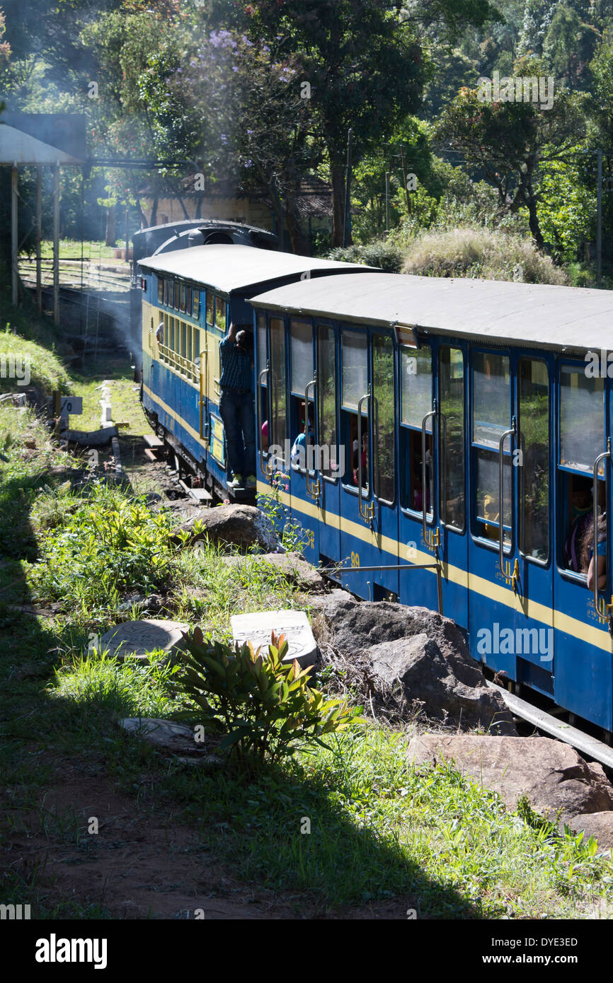 A Nilgiri Mountain Railway steam train makes progress through the Nilgiri Hills, Tamil Nadu, India Stock Photo