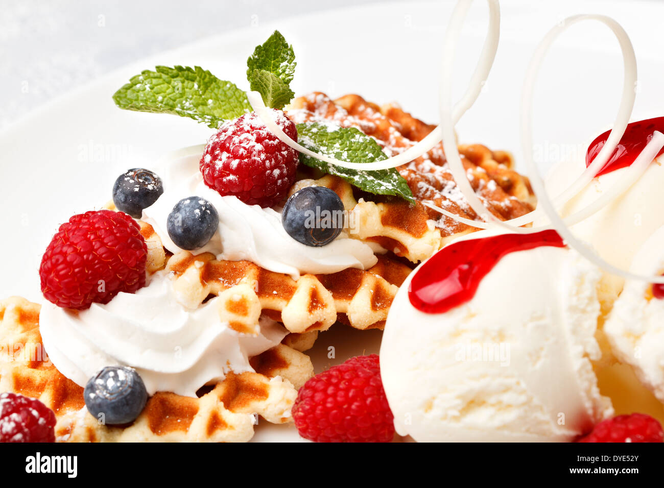 Waffle with vanilla ice cream and fresh berries Stock Photo - Alamy