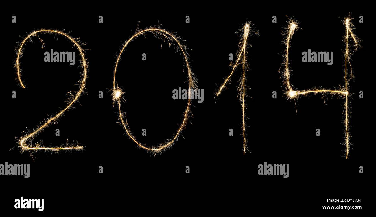 Digits 2014 written with sparklers isolated on black Stock Photo