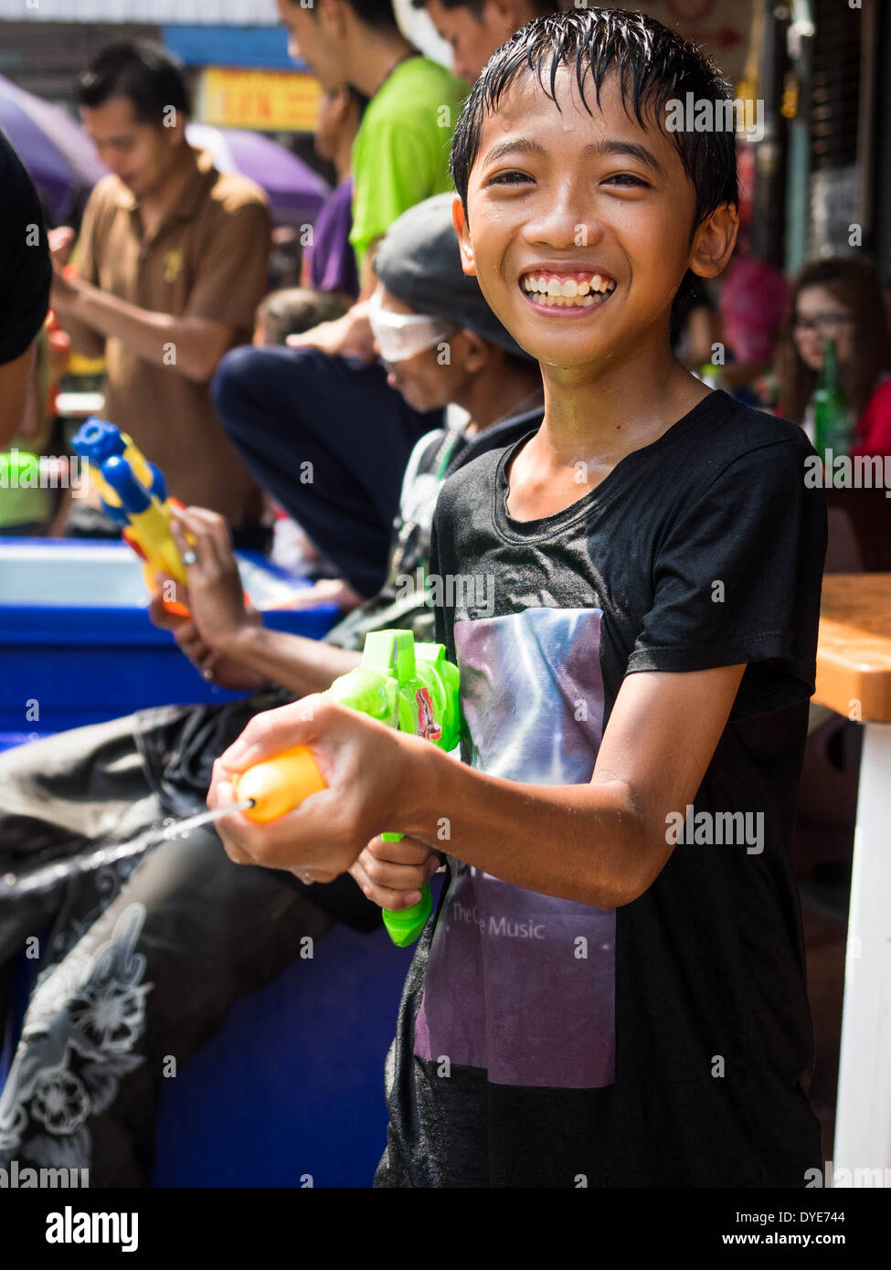 Thai boy celebrating Songkran in Bangkok, Thailand. Stock Photo