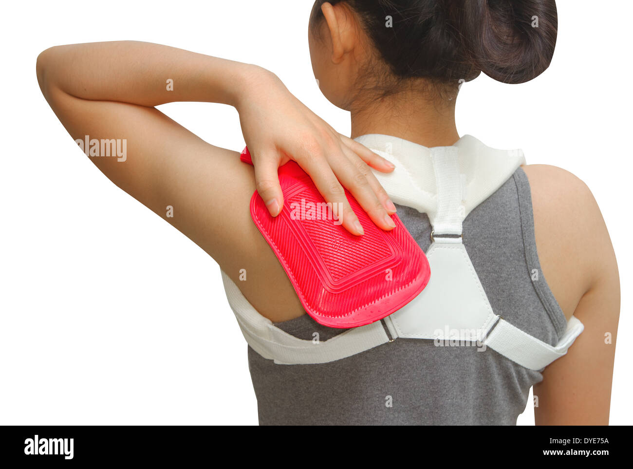 woman putting a hot pack on her shoulder pain Stock Photo