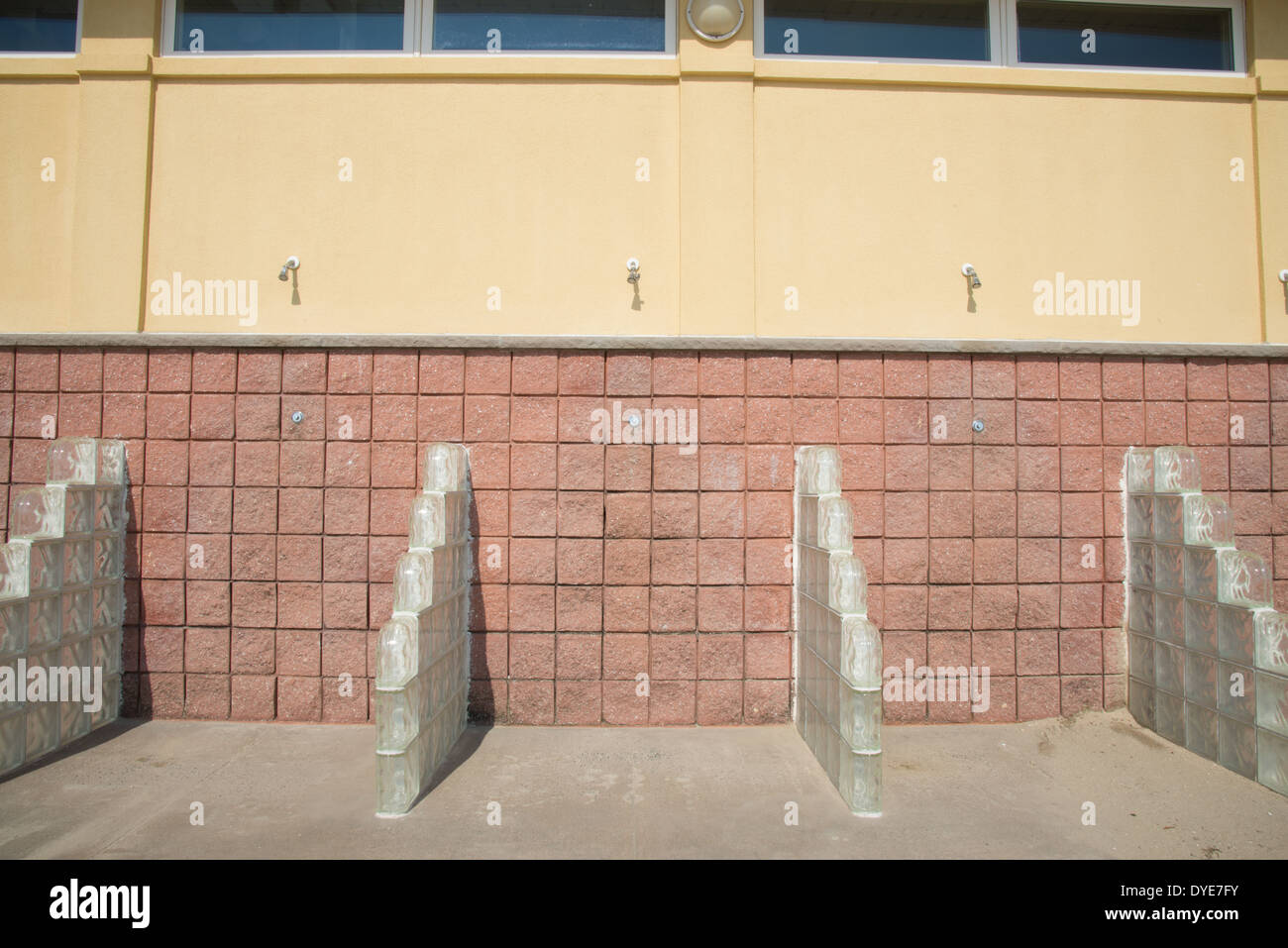 Outdoor Showers With Glass Block Partitions At The Beach In