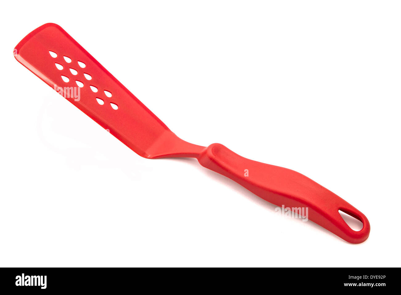 Red kitchen spatula on a white background Stock Photo