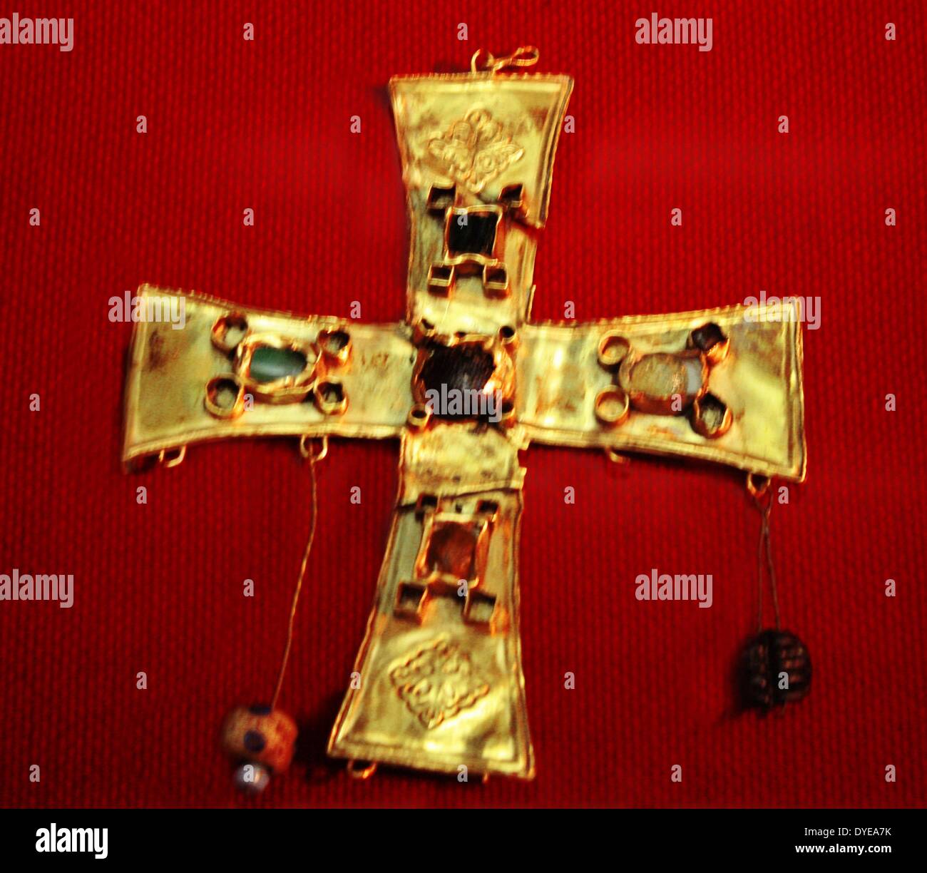 Gold cross with glass beads and fine stones. Barcelona. Spain 2013 Stock Photo