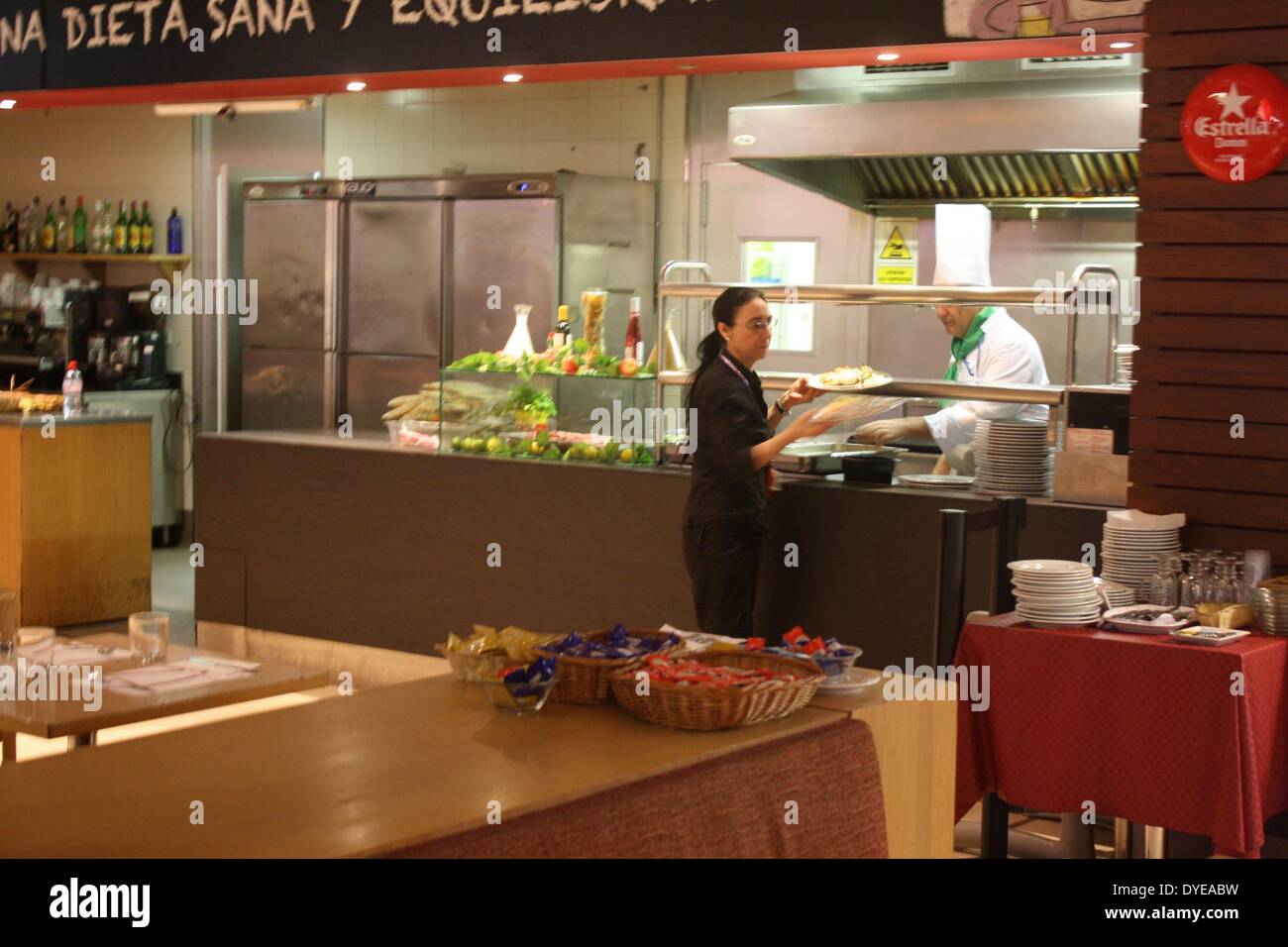 Collecting food in a restaurant in airport barcelona spain hires stock