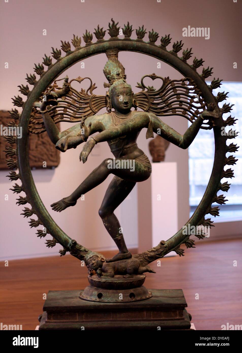 Shiva Nataraja. India, Tamil Nadu Chola style 12th century, bronze. Shiva, in his manifestation as Nataraja (King of Dancers), represented in the anandatandava pose and encircled by a halo of fire, is both the creator and destroyer of the world. Beneath his foot is a dwarf, symbolizing ignorance. Stock Photo