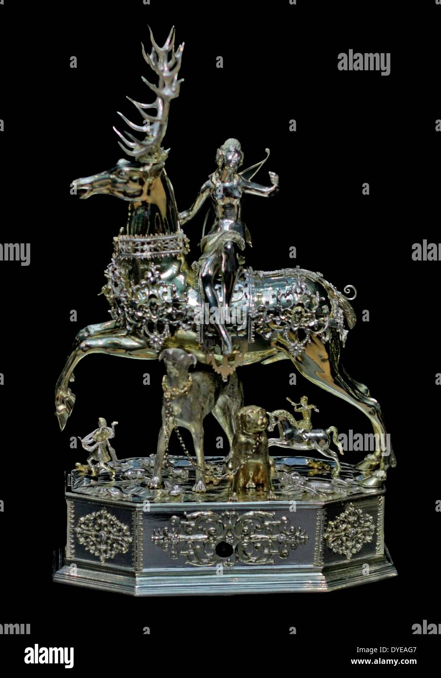 Table automaton in the form of Diana on a stag. Jacob Miller (c 1550-1618) Augsburg, c 1613-1615 parcel-gilt and polychromed silver. This is an expensive toy for the entertainment of dinner guests. It can roll over the table, since the base of the 'sculpture' has wheels and a movement to propel it forward. The head of the stag can be removed and its body filled with wine. The guest in front of whom Diana stops may take the first drink. Stock Photo