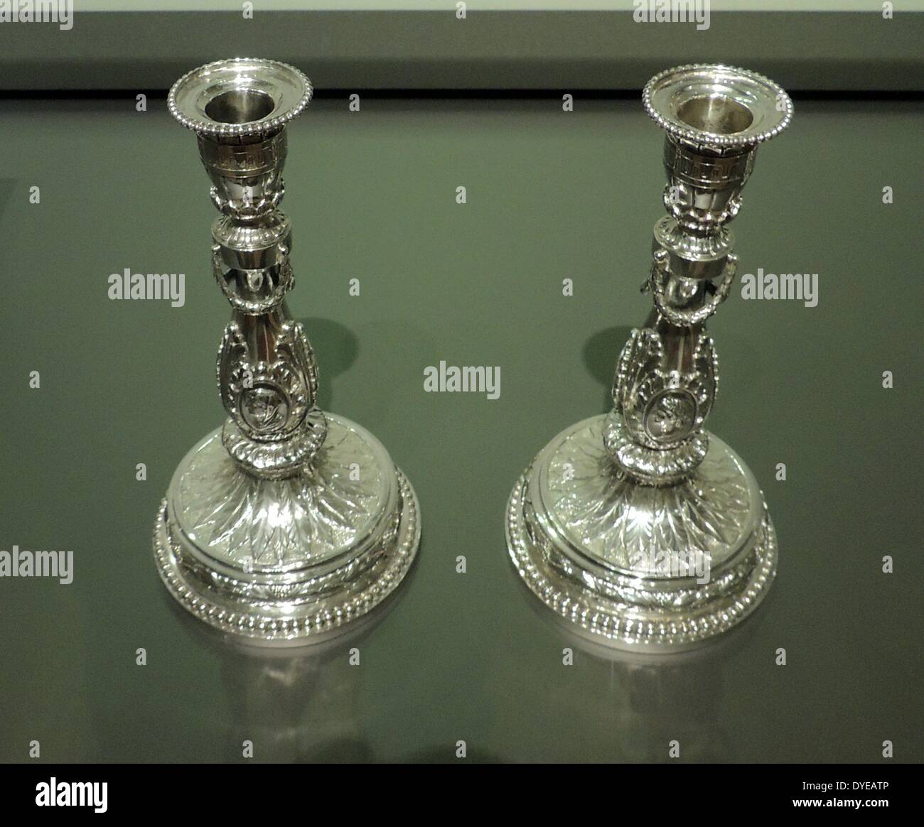 Pair of candlesticks by Johannes Schlotling (1730-1799), Amsterdam, 1785, silver. These candlesticks with acanthus leaves, medallions and festoons were inspired by a design by Paris artist Jean Francois Forty that was published around 1780. This type of short candlestick was probably intended for a dressing or gaming table. Stock Photo