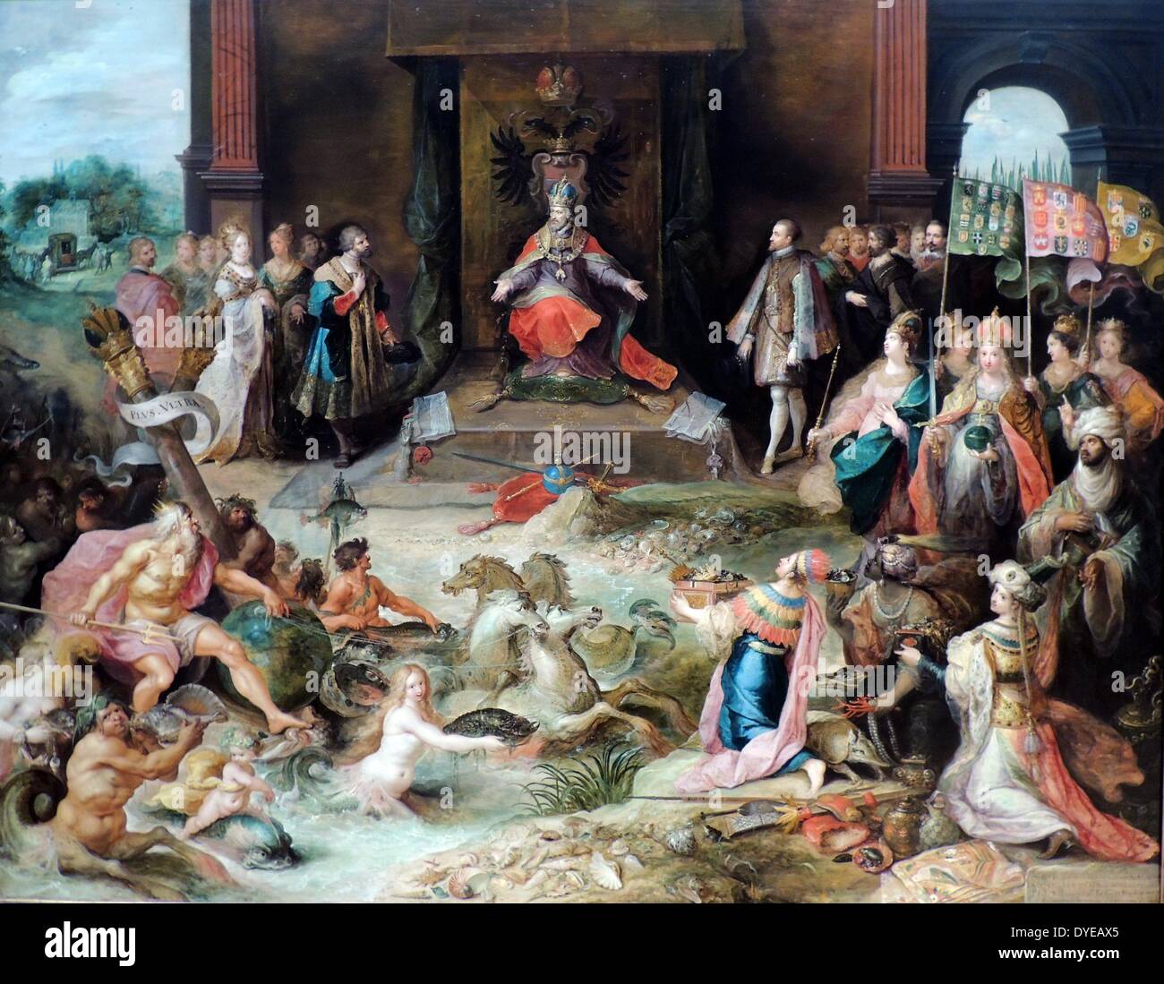 Allegory on the Abdication of Emperor Charles V in Brussels. Frans Francken II (1581-1642) oil on panel, (c 1630-1640) Charles V is enthroned at centre. Battle weary and wracked by illness, in 1555 he divided up his empire. He gave his brother Ferdinand (left of the throne) the Holy Roman Empire, while his son Phillip (at the right) became King of Spain and Lord of the Netherlands. The four figures in the right foreground personify the continents over which Charles's vast empire stretched. Neptune (left) symbolized his power at sea. Stock Photo