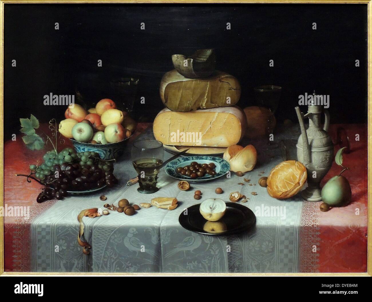 Still Life with Cheese by Floris Claesz van Dijck (1575-1651) oil on panel, c 1615. Fruit, bread and cheese - grouped by type - are set on a table covered with damask tablecloths. The illusion of reality is astounding, the pewter plate extending over the edge of the table seems close enough to touch. The Haarlem painter Floris van Dijck ranked among the pioneers of Dutch still-life painting. Stock Photo