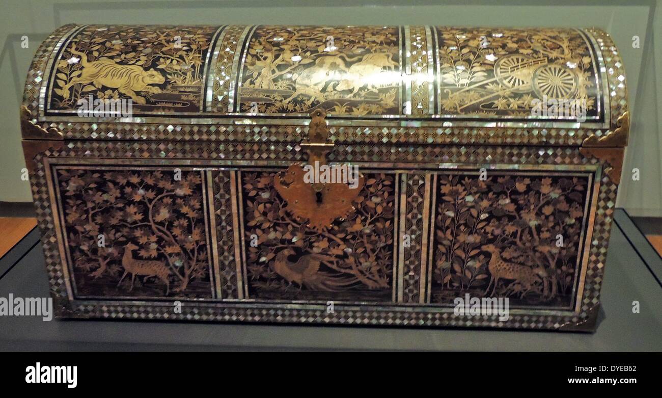 Trunk. Japan, c. 1575-1625, Nanban lacquer ware. The trunk is decorated with gold lacquer and inlaid mother-of-pearl. This type of lacquer ware is call Nanban. The Japanese used this word to refer to foreign traders in Japan - first the Portuguese and from 1609, also the Dutch. The shape of the trunk and its scenes follow European models. The mother-of-pearl bands imitate the metal mounts on a Western-style European chest. Stock Photo