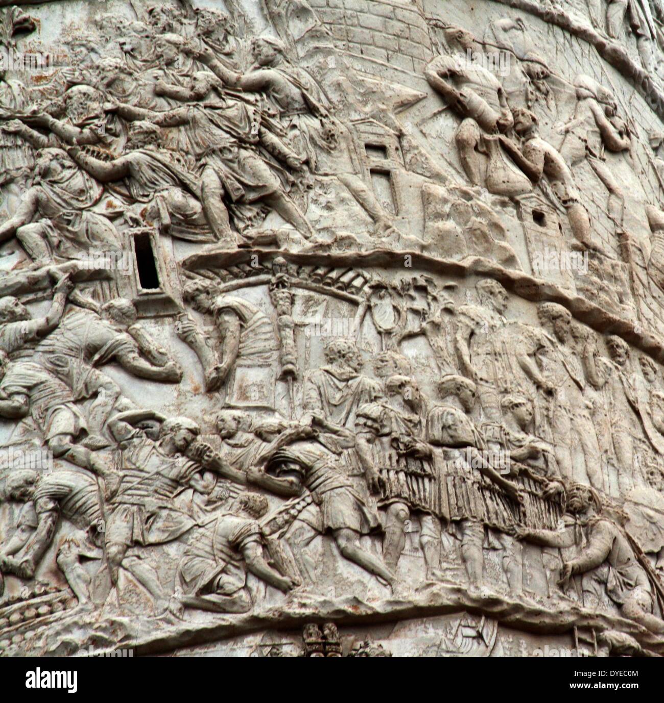Trajan's Column is a Roman column commemorating the Roman Emperor Trajan's victory in the Dacian Wars. Located in Trajan's Forum, north of the Roman Forum. The spiral Bas Relief artistically describes the epic battles between the Romans and Dacians. Completed in 113 AD. Rome. Italy 2013 Stock Photo
