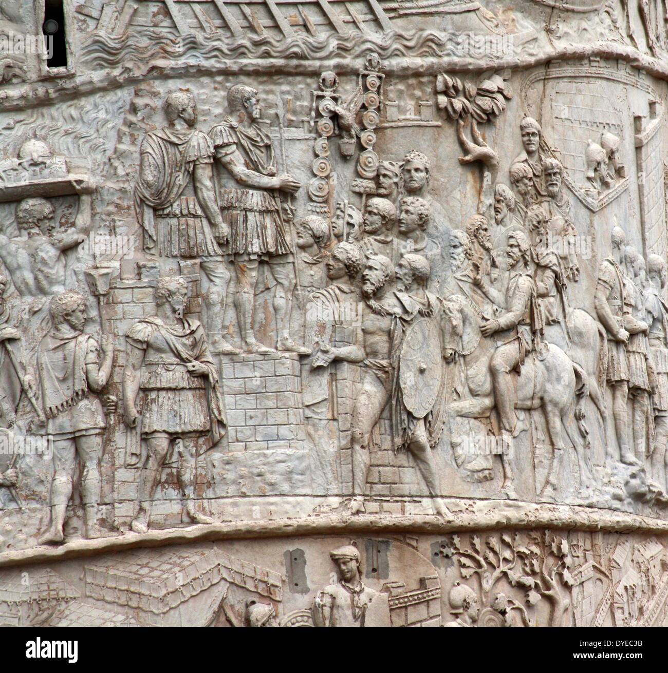 Trajan's Column is a Roman column commemorating the Roman Emperor Trajan's victory in the Dacian Wars. Located in Trajan's Forum, north of the Roman Forum. The spiral Bas Relief artistically describes the epic battles between the Romans and Dacians. Completed in 113 AD. Rome. Italy 2013 Stock Photo