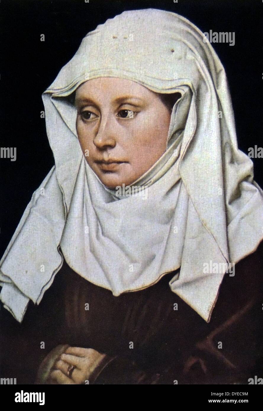 Life-size portrait of a wife wearing a white kerchief on her head. By an unknown Flemish painter. Stock Photo