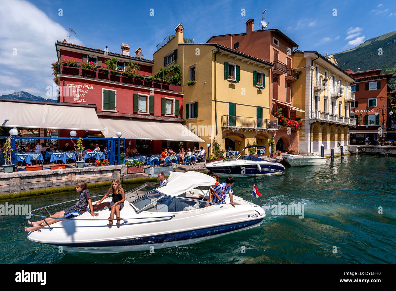 A Family Taking A Speedboat Trip, Malcesine, Lake Garda, Italy Stock Photo
