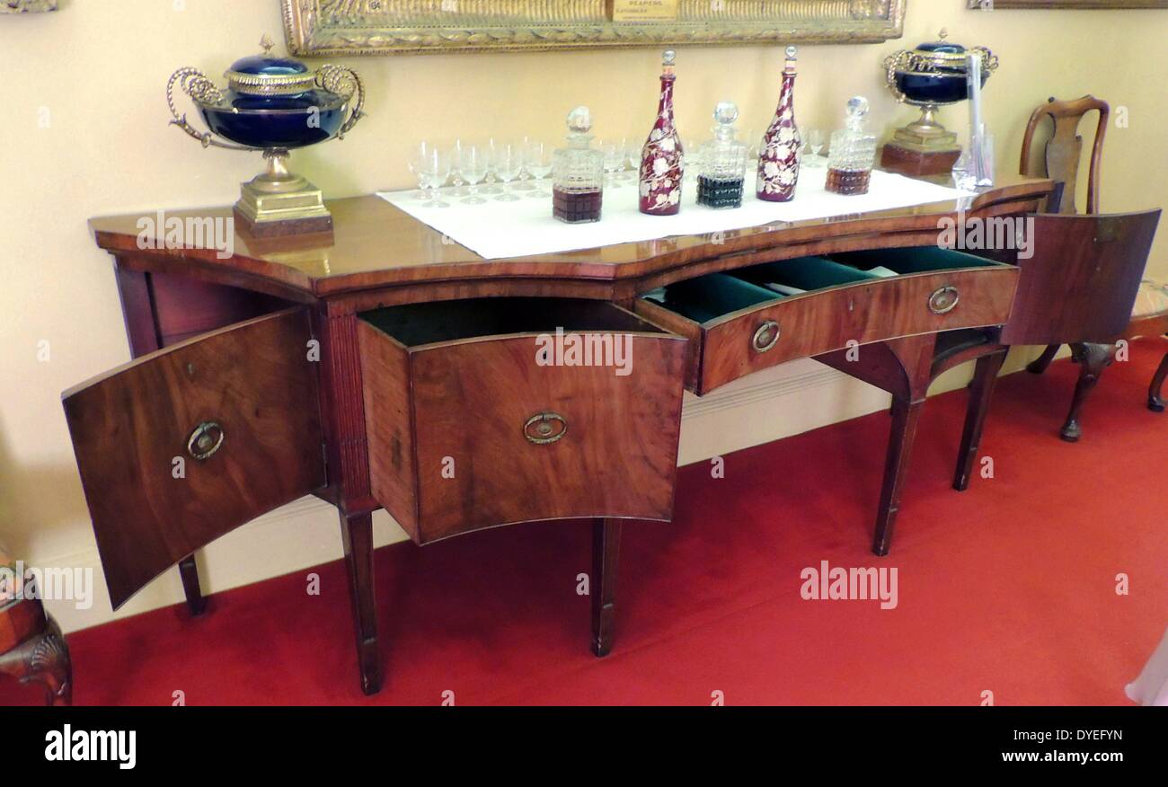 Early twentieth century dresser with decanters bottles and glasses 2013 A.D. Stock Photo