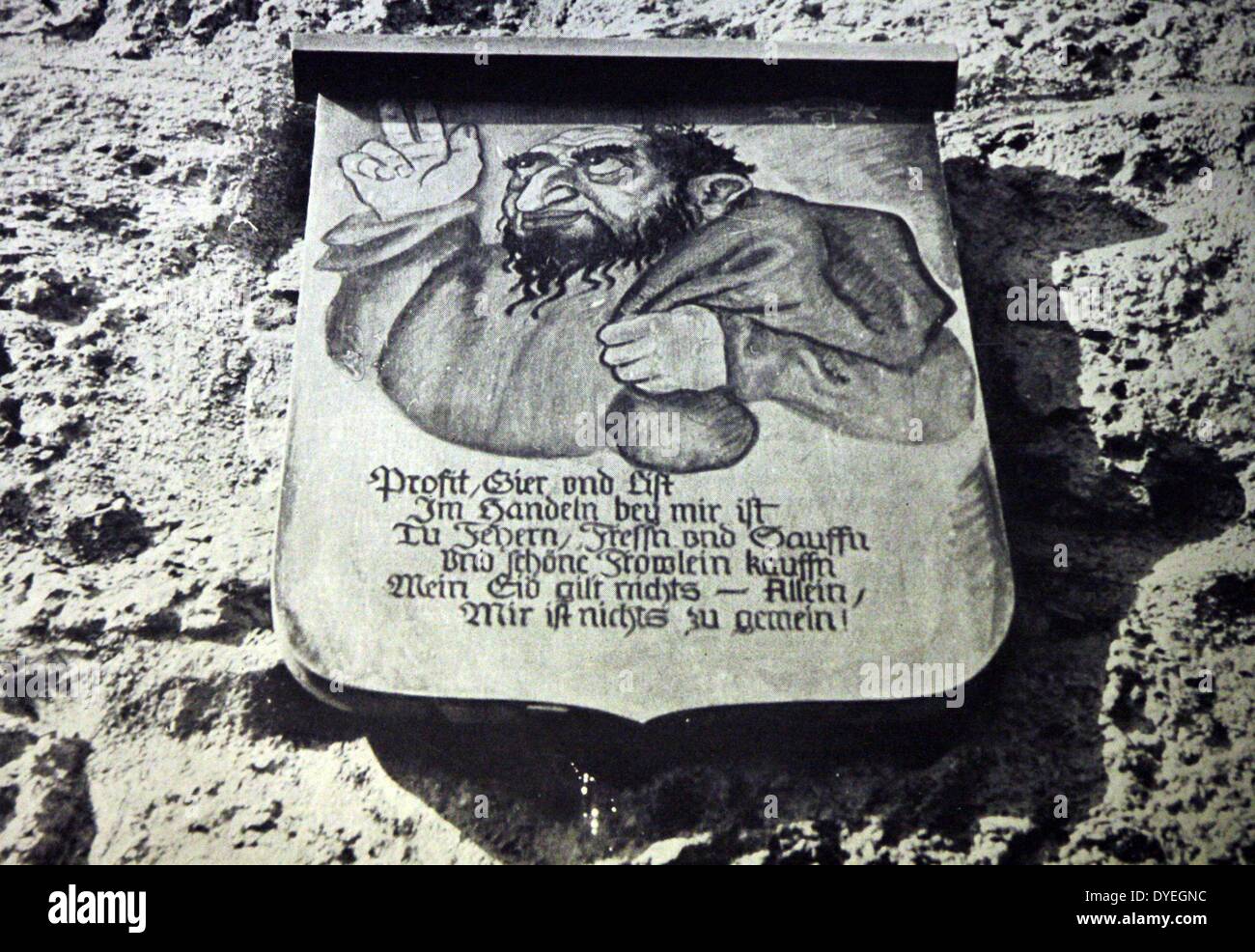 Inscription on the town wall of Rothenburg, Germany. The placard shows a Jew clutching a bag of money, and the text reads: Making big profits, Greed and craftiness is my business. I like celebrating, eating and drinking and like buying nice girls. My oath does not mean a thing - in fact nothing is too low for me. Stock Photo