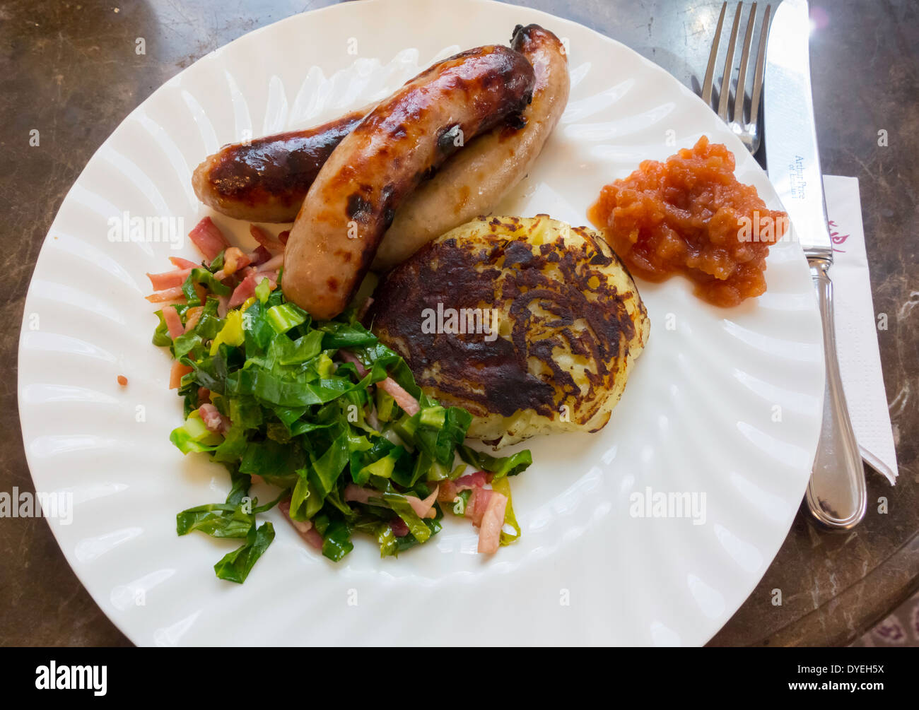 Delicious lunch Yorkshire Sausages with Swiss Rosti potatoes cabbage