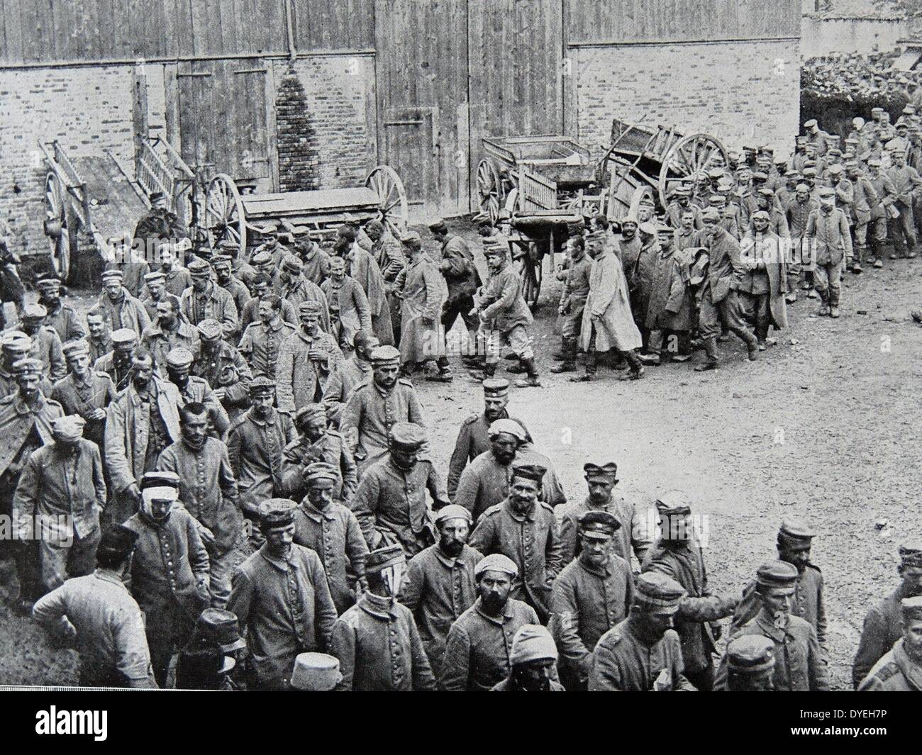 World War 1 - German prisoners of war parade through a farmyard. France 1915 Stock Photo