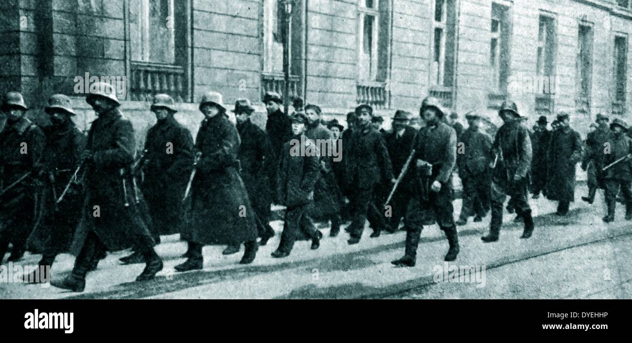 German government forces arrest spartacists 1919. The Spartacist uprising (Spartakusaufstand), was a general strike and the armed battle in Germany from January 4 to January 15, 1919. Its suppression marked the end of the German Revolution. The name 'Spartacist uprising' is generally used for the event even though neither the 'Spartacist League' nor the Communist Party of Germany led this uprising; each participated only after popular resistance had begun. Stock Photo