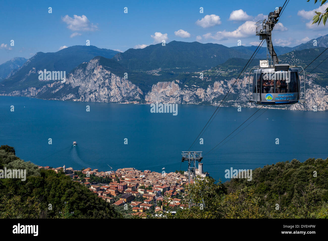 A Cable Car Above The Town Of Malcesine, Lake Garda, Italy Stock Photo