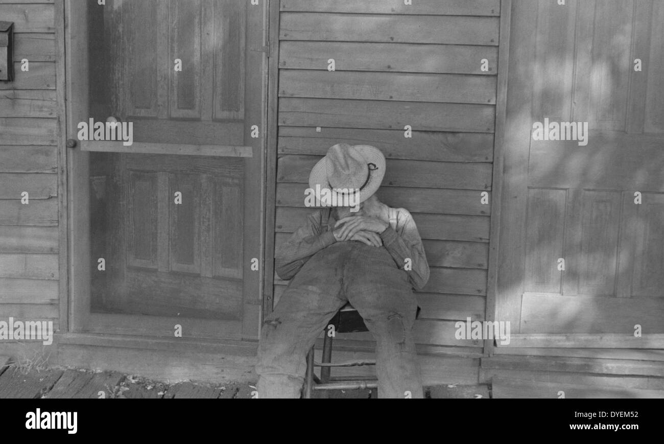 Ex-farmer resting by a house in Circleville, Ohio's Hooverville. 1938. Stock Photo