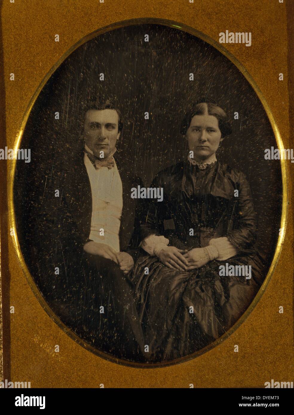 Unidentified man and woman, three-quarters length portrait, seated, by Francis Grice, photographer. 1855: quarter-plate daguerreotype. Stock Photo