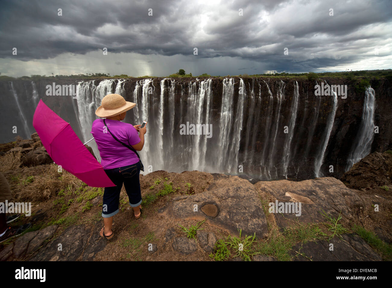 tourist at Victoria Falls, Zimbabwe, Africa Stock Photo