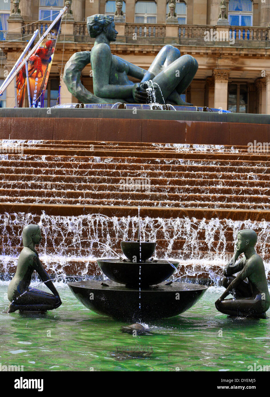 Fountain in Victoria Square, Birmingham, England.  statues and fountain represent youth . This bronze sculpture,  is 1.5 m (5 ft) tall and 1.5 m (5 ft) in diameter. It depicts a boy and a girl facing each other at either ends of a fountain. Beside them are an egg and a cone Stock Photo