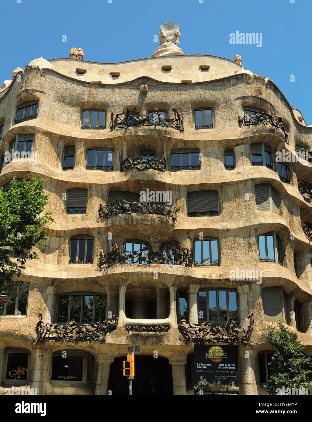 the facade of Casa Milà known as La Pedrera (meaning the 'The Quarry')is a building designed by the Catalan architect Antoni Gaudi and built during the years 1906–1912. It is located at 92, Passeig de Gràcia (Passeig is Catalan for promenade) in the Example district of Barcelona, Catalonia, Spain. It was a controversial design at the time for the bold forms of the undulating stone facade and wrought iron decoration of the balconies and windows, designed largely by Josep Maria Jujol, who also created some of the plaster ceilings. Stock Photo