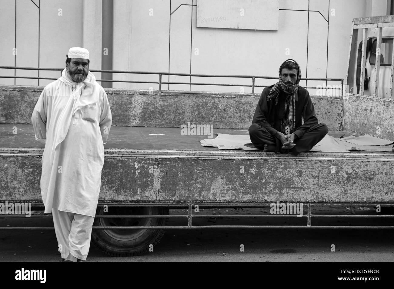 Labors in Najma , Doha , Qatar.  Most of these labors are paying their sponsors a monthly fee to be able to work in Qatar. Stock Photo