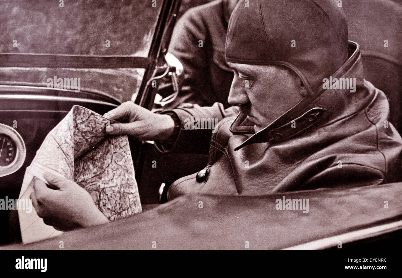 Adolf Hitler 1889-1945. driving on holiday near a country retreat. German politician and the leader of the Nazi Party driving a car. He was chancellor of Germany from 1933 to 1945 and dictator of Nazi Germany from 1934 to 1945. Stock Photo