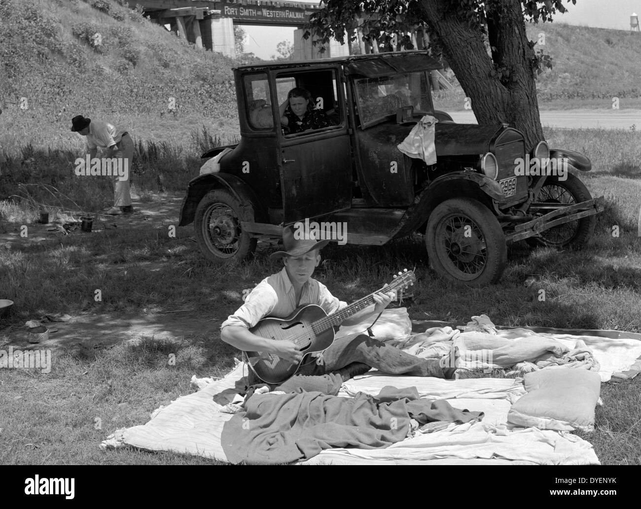 Camp of migrant workers near Prague, Oklahoma. Lincoln County by Russell Lee, 1903-1986, dated 19390101. Stock Photo