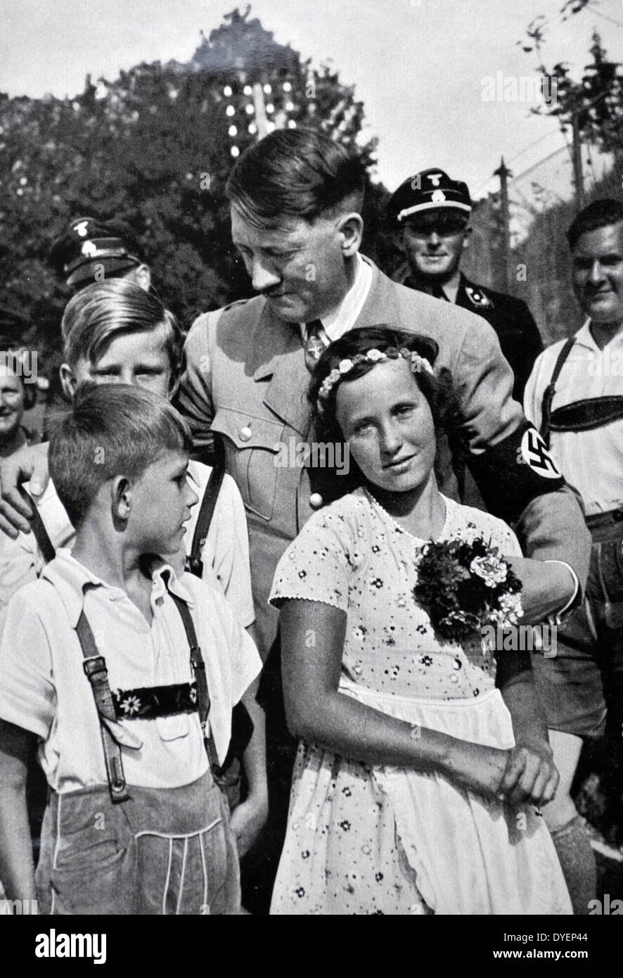 Adolf Hitler 1889-1945. German politician and the leader of the Nazi Party, greeted by  Hitler Youth  as Baldur von Schirach looks on Stock Photo