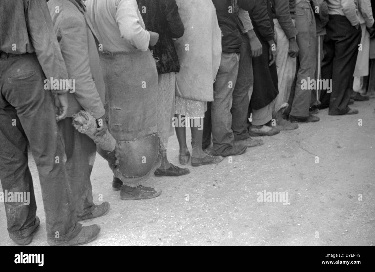 Vegetable workers, migrants, waiting after work to be paid. Near Homestead, Florida dated 19380101 Stock Photo