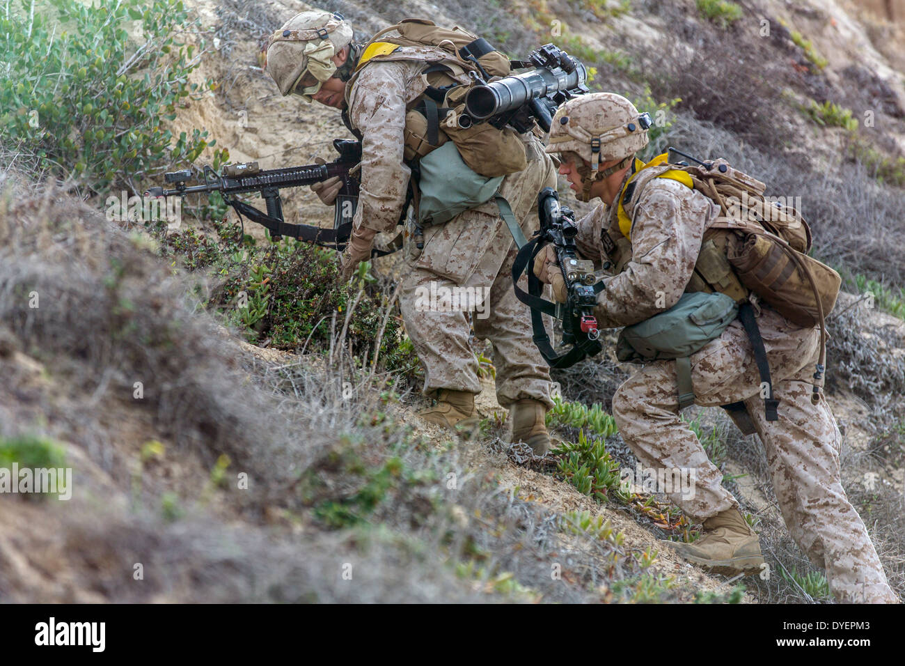 US Marines provides security during a Marine Corps Combat Readiness Evaluation in simulated Afghan terrain March 17, 2014 at Camp Pendleton, California. The training tests the proficiency of Marines before upcoming deployments. Stock Photo